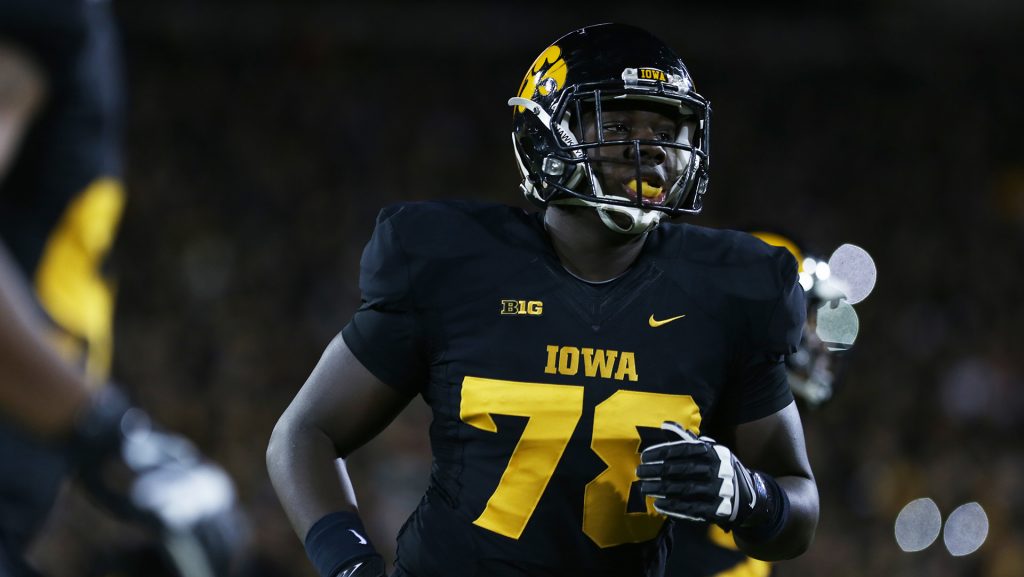 Iowa offensive lineman James Daniels runs to the sidelines in Kinnick Stadium on Saturday, Nov. 14, 2015. The Hawkeyes defeated the Golden Gophers, 40-35 to stay perfect on the season. (The Daily Iowan/Rachael Westergard)