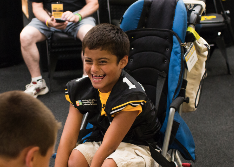 Kid Captain Mason Gonzalez laughs during Iowa Football Kids' Day at Kinnick Stadium on Saturday, Aug 11, 2018. 