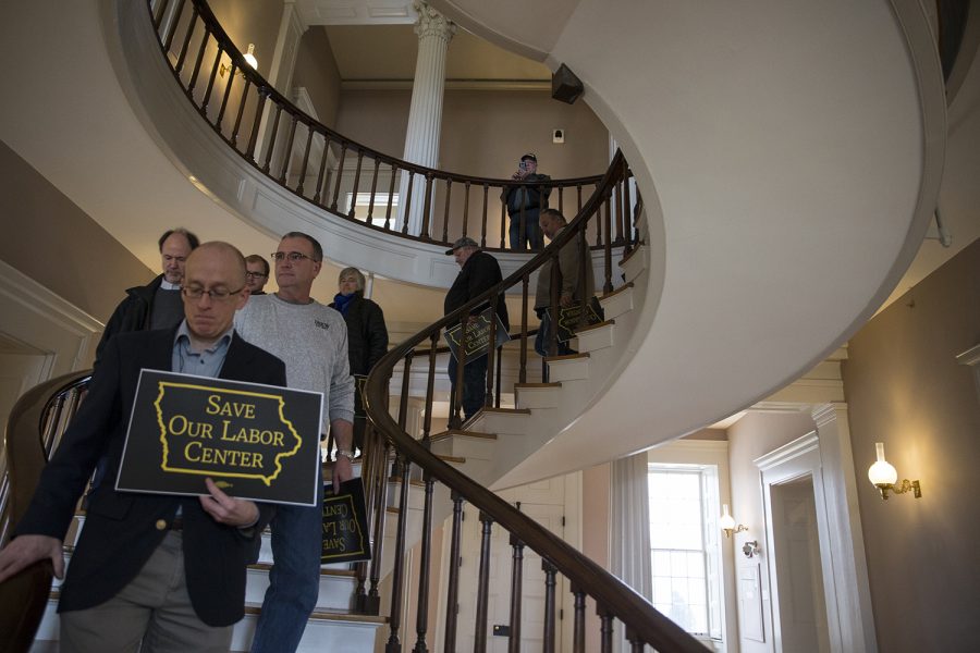 Crowd members move out of the meeting room to walk to President Bruce Harreld's office during the Labor Center Statewide Summit in the Old Capitol Senate Chambers on Monday Dec. 3, 2018. Members of the university and the community addressed concerns over the Labor Center closure before taking their petition to Harreld's office. 