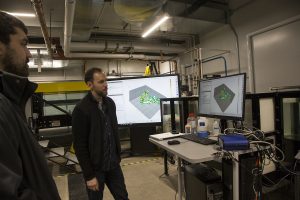 Kevin Wabick, a graduate student with the college of Engineering, presents the dye visualization on experimental models during the Engineering Fluids Laboratories Open House in the Seamans Center on Jan 18, 2019. During the open house students were able to participate in a variety of interactive stations and view demonstrations. 