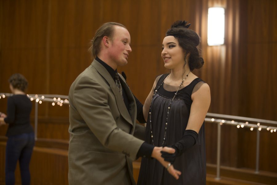 A couple dancing and dressed in 1920s style clothing at the Swing Dance Club's Gatsby Dance on Jan. 26 at the IMU.