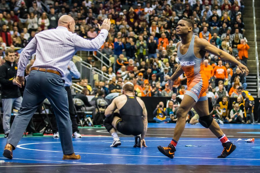 Iowa’s 165-pound Alex Marinelli wrestles Virginia Tech’s Mekhi Lewis during the third session of the 2019 NCAA D1 Wrestling Championships at PPG Paints Arena in Pittsburgh, PA on Friday, March 22, 2019. Lewis won by decision, 3-1.