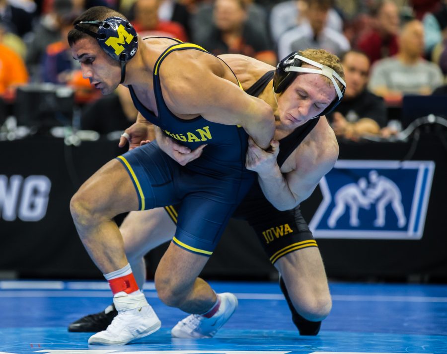 Iowa’s 157-pound Kaleb Young wrestles Michigan’s Alec Pantaleo during the fifth session of the 2019 NCAA D1 Wrestling Championships at the PPG Paints Arena in Pittsburgh, PA on Saturday, March 23, 2019. Pantaleo won by decision, 6-2.