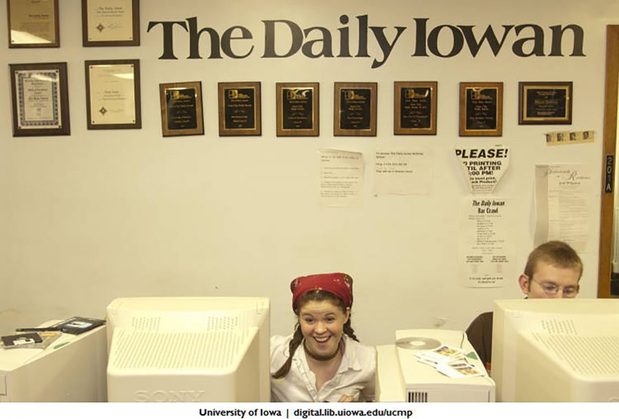 Daily Iowan staffers are seen working in their office in the Communications Building.