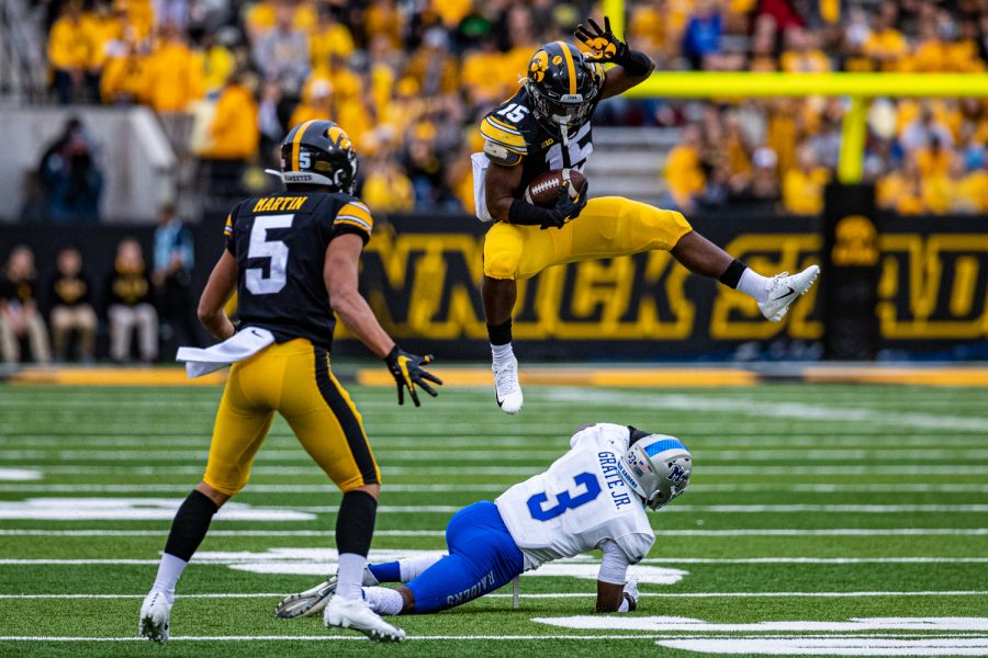 Iowa running back Tyler Goodson hurdles MTSU's Gregory Grate, Jr. during a football game between Iowa and Middle Tennessee State at Kinnick Stadium on Saturday, September 28, 2019. 