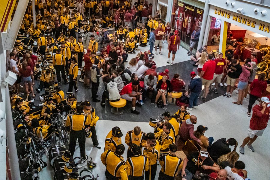 Marching band members escape the rain during a football game between Iowa and Iowa State at Jack Trice Stadium in Ames on Sept. 14, 2019.
