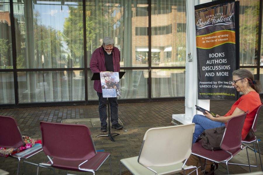 A volunteer reader speaks during a public reading of War and Peace on the Ped Mall on Monday Sept. 30, 2019. As part of the Iowa City Book Festival, readings will continue on the Ped Mall for three days. 
