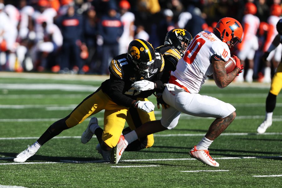 Iowa defensive back Michael Ojemudia prepares for a tackle during the football game against Illinois on Saturday, November 23, 2019.  