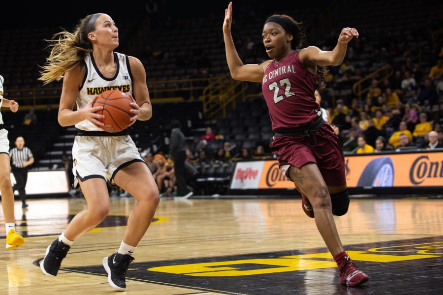 Iowa guard Kate Martin attemps to shoot the ball past NC Central's Zaria Atkins during a game against North Carolina Central University on Saturday, Dec. 14, 2019 at Carver Hawkeye Arena. The Hawkeyes defeated the Eagles, 102-50.