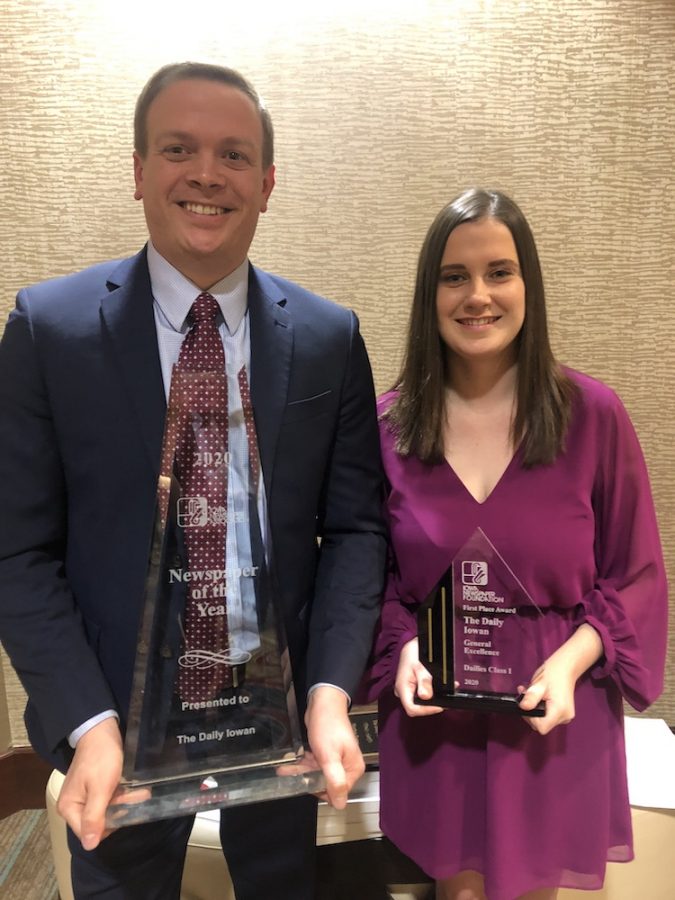 DI Publisher Jason Brummond and DI editor Marissa Payne hold the DI's Newspaper of the Year and General Excellence trophies at the Iowa Newspaper Association Convention in Des Moines on Feb 7, 2020. "Holy sh*t," Brummond profoundly put it when the two left the dinner table to accept the Newspaper of the Year award.