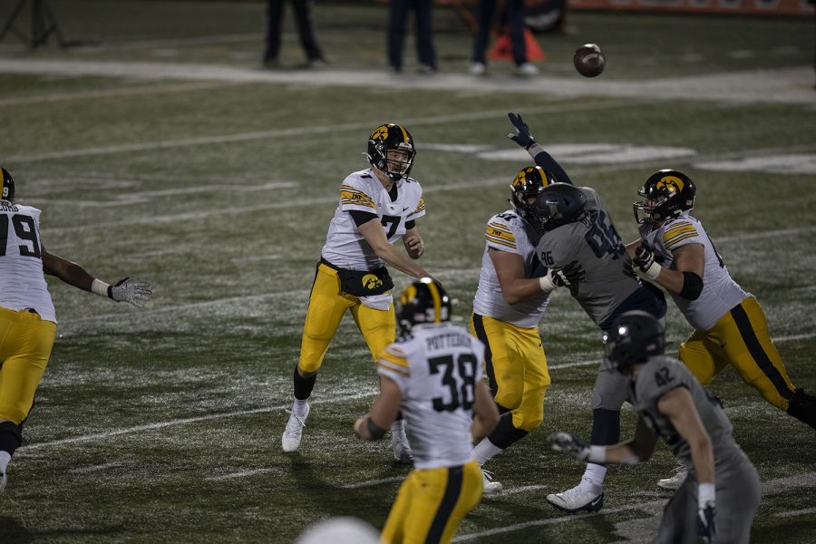 Iowa quarterback Spencer Petras (7) throws a pass during the third quarter of the Iowa v. Illinois football game at Memorial Stadium on Saturday, Dec. 5, 2020. Iowa defeated Illinois with a final score of 35-21.