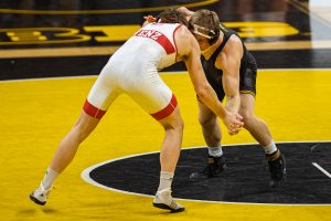 Iowa’s 184-pound Nelson Brands grapples with Nebraska’s Taylor Venz during a wrestling dual meet between No. 1 Iowa and No. 6 Nebraska at Carver Hawkeye Arena on Friday, Jan. 15, 2021. No. 8 Brands defeated No. 7 Venz by major decision, 13-5, and the Hawkeyes defeated the Cornhuskers, 31-6. (Shivansh Ahuja/The Daily Iowan)