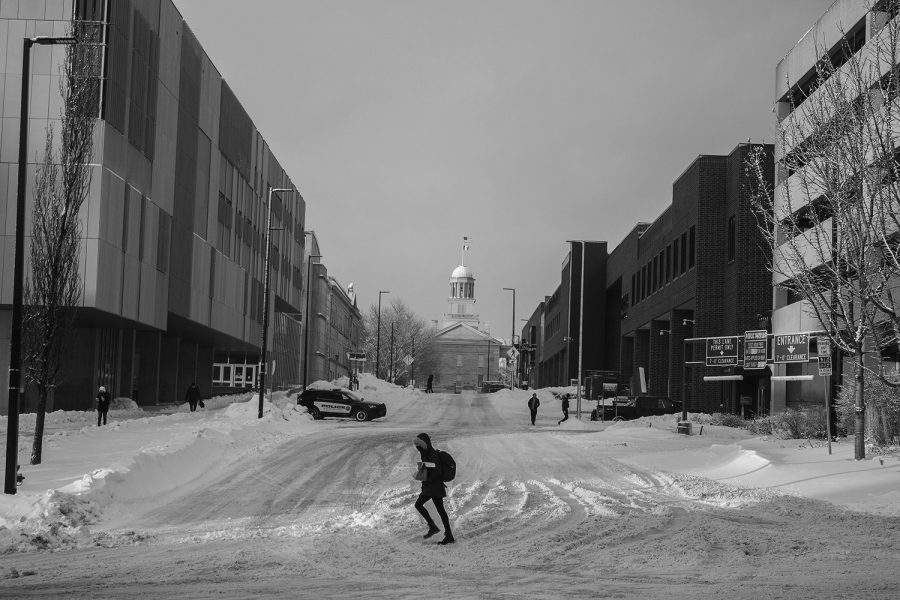 Several students are seen walking on the University of Iowa campus on Feb. 4 after a snowstorm rolled through earlier that day.