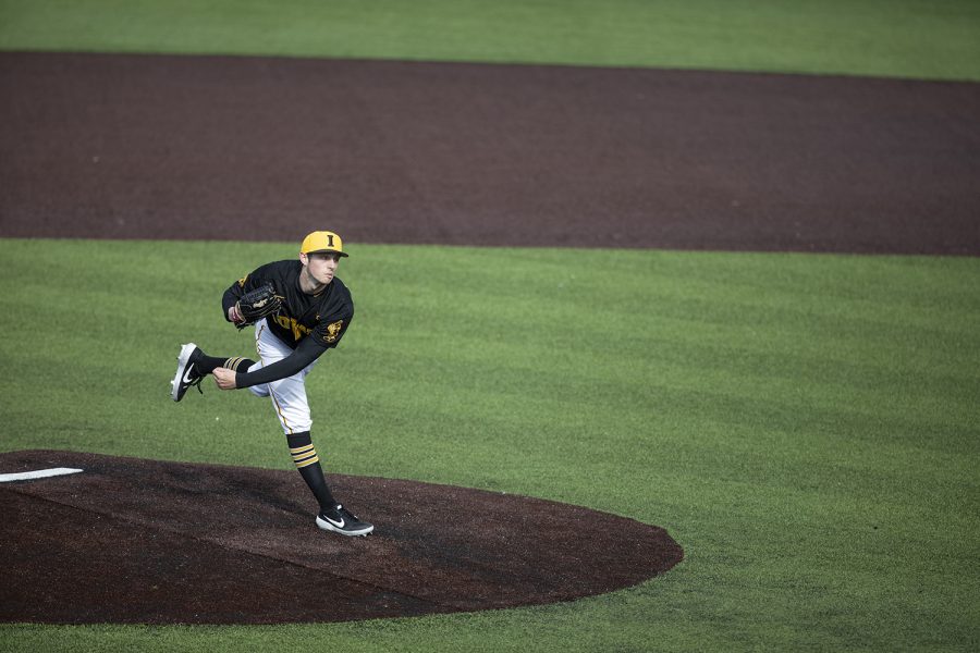 Hawkeye pitcher Trenton Wallace pitches during the baseball game against Illinois at Duane Banks Field on March 30, 2019. The Hawkeyes defeated the Fighting Illini 2-1 after the 9th inning.