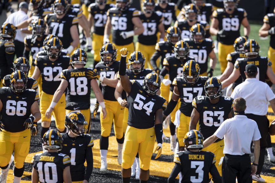 Iowa Defensive Tackle Daviyon Nixon raises his fist as the Hawkeyes take to their home field for the first time in the season during the Iowa v Northwestern football game at Kinnick Stadium on Saturday, Oct. 31, 2020.  The Wildcats defeated the Hawkeyes 21-20. 