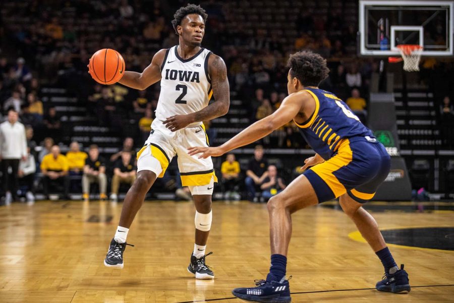 Iowa guard Joe Toussaint sizes up Missouri-Kansas City guard Jacob Johnson during a men’s basketball game between Iowa and Missouri-Kansas City at Carver-Hawkeye Arena in Iowa City on Thursday, Nov. 11, 2021. 