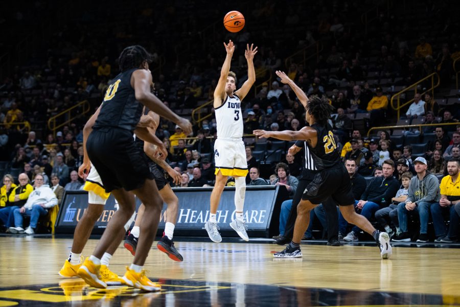 Iowa guard Jordan Bohannon shoots a three-pointer at a basketball game between Iowa and Alabama State at Carver-Hawkeye Arena Thursday, Nov. 18, 2021. Bohannon went 4 for 8 for three-pointers and broke a Big Ten record for career three-pointers. Iowa won 108-82.