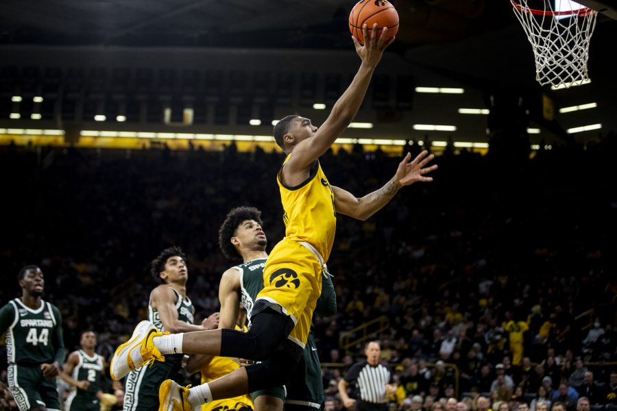 Iowa guard Tony Perkins releases a shot during a men’s basketball game at Carver-Hawkeye Arena between No. 25 Iowa and Michigan State on Tuesday, Feb. 22, 2022. Perkins picked up five points. The Hawkeyes defeated the Spartans, 86-60.