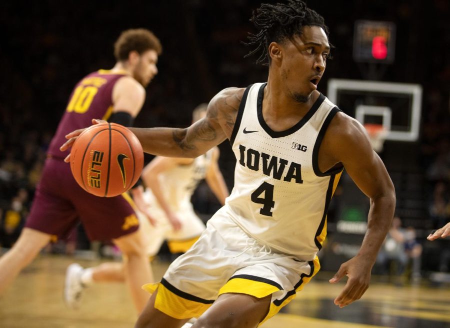 Iowa men's basketball guard Ahron Ulis dribbles the ball during a game against Minnesota on Feb. 6, 2022. The Hawkeyes beat the Golden Gophers, 71-59.