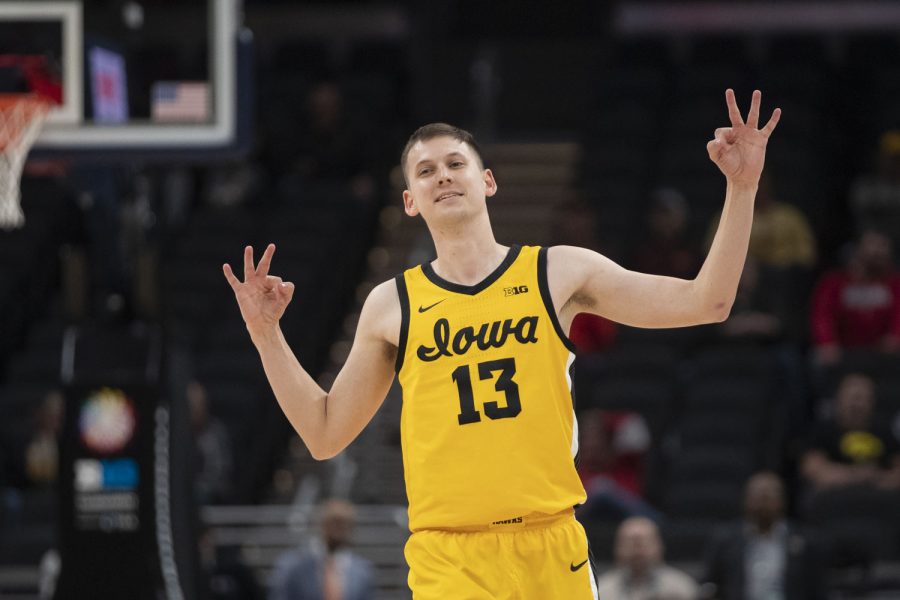 Iowa guard Austin Ash celebrates a 3-pointer during a men’s basketball game between No. 5 Iowa and No. 12 Northwestern in the Big Ten Basketball Tournament at Gainbridge Fieldhouse in Indianapolis on Thursday, March 10, 2022. The Hawkeyes defeated the Wildcats, 112-76. Ash scored 5 points. (Dimia Burrell/The Daily Iowan)