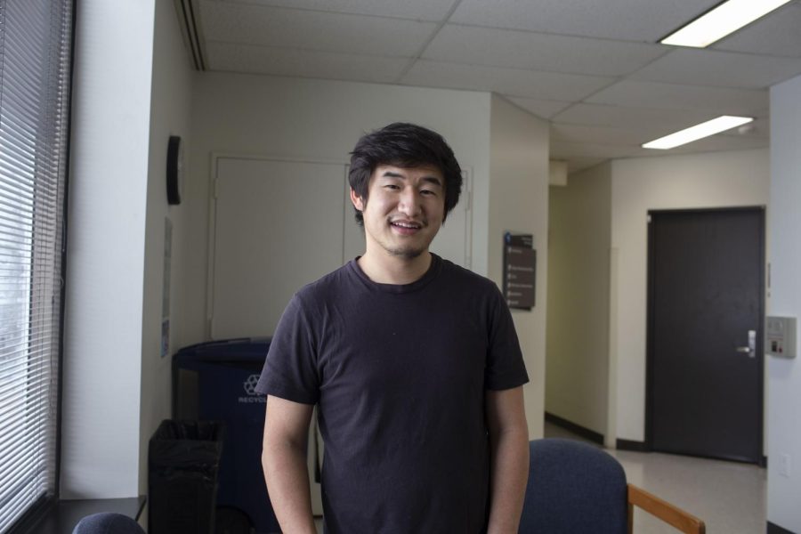 Jin Chang, creator of the No Longer Invisible exhibit at the University of Iowa, poses for a portrait at the Lindquist Center on April 7, 2022.  