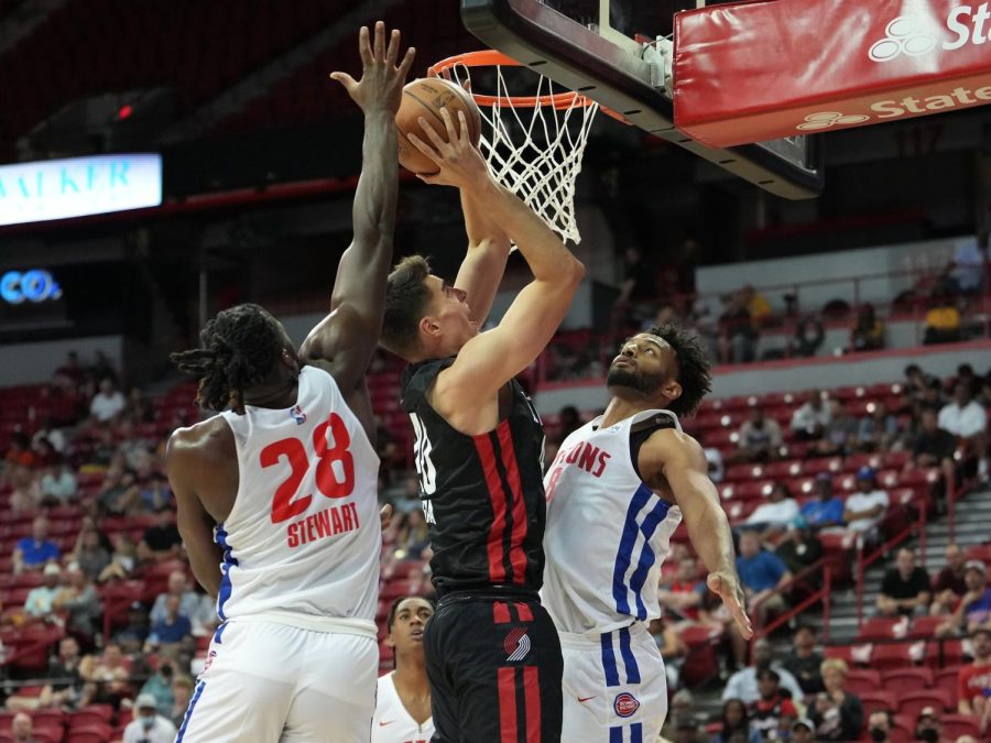 Jul 7, 2022; Las Vegas, NV, USA; Portland Trail Blazers center Luka Garza (40) shoots between Detroit Pistons center Isaiah Stewart (28) and Detroit Pistons forward Braxton Key (8) during an NBA Summer League game at T&M. Mandatory Credit: Stephen R. Sylvanie-USA TODAY Sports