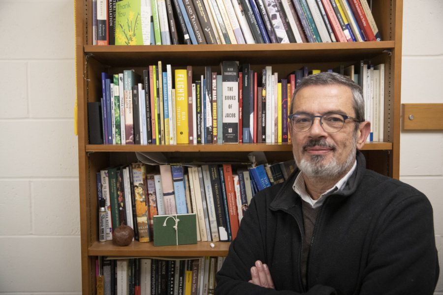 Dr. Aron Aji poses for a portrait in his office in Phillips Hall, Iowa City Iowa on Nov. 14th. Dr. Aji has two upcoming translated works.