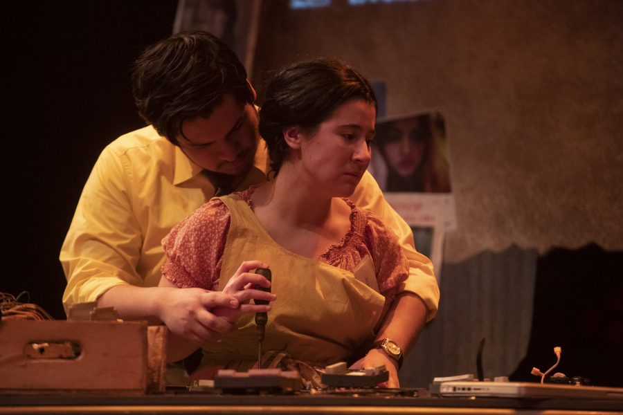 Señor Fillmore, played by Johan Avila, helps Alma, played by Sara Alvidrez, with her work during a dress rehearsal for the University of Iowa theater department’s production of Braided Sorrow Thursday, Feb. 2, 2023. 