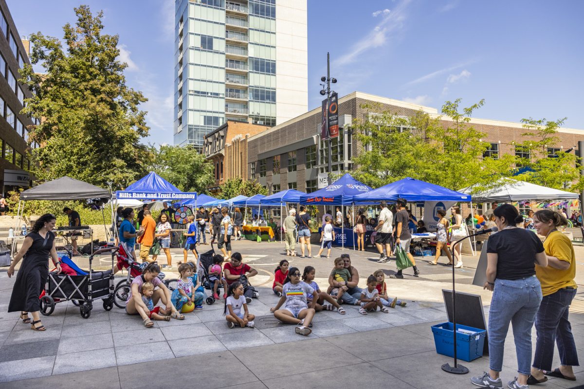 Members of the Iowa City Public Library read to children and community members at the 2023 Iowa City Latino Fest on the Pedestrian Mall downtown on Saturday, Aug. 26, 2023. Vendors sold food while community members enjoyed Latino traditions, music, food, and dance. Over 11 years, 50,00 attendees have visited the annual festival with over 80 performances in the Iowa City tradition. 