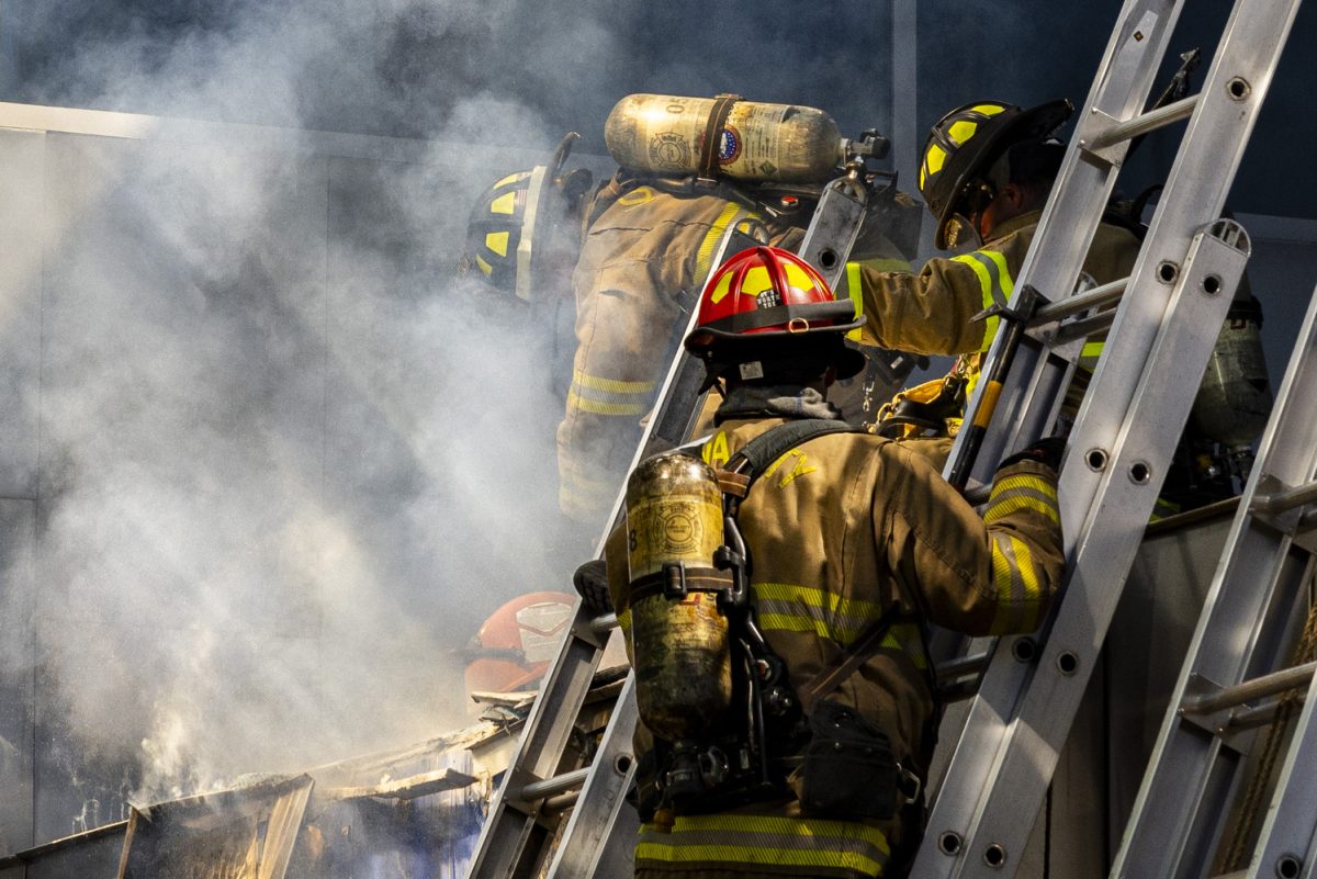 A firefighter saws through the Advanced Technology Laboratories during a fire on the University of Iowa campus in Iowa City on Friday, Sept. 1, 2023. The first Hawk Alert urged people to avoid the area around 10:54 a.m. On Thursday, Firefighters and other first responders arrived at the building to fight an active fire at around 1:30 p.m.