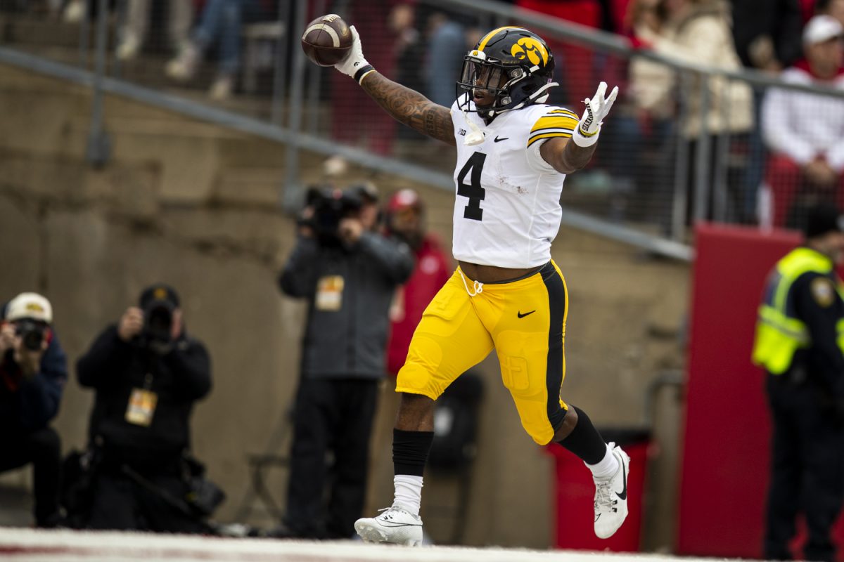 Iowa running back Leshon Williams celebrates in the end zone after a rushing touchdown during a football game between Iowa and Wisconsin on Saturday, Oct. 14, 2023. 