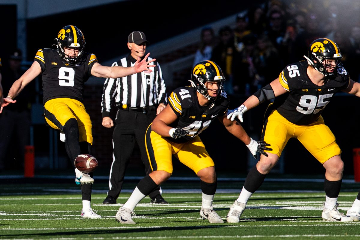Iowa punter Tory Taylor punts the ball during a football game between Iowa and Illinois at Kinnick Stadium on Saturday, Nov. 18, 2023. Taylor punted for 413 total yards, averaging 51.6 per play. The Hawkeyes defeated the Fighting Illini, 15-13.