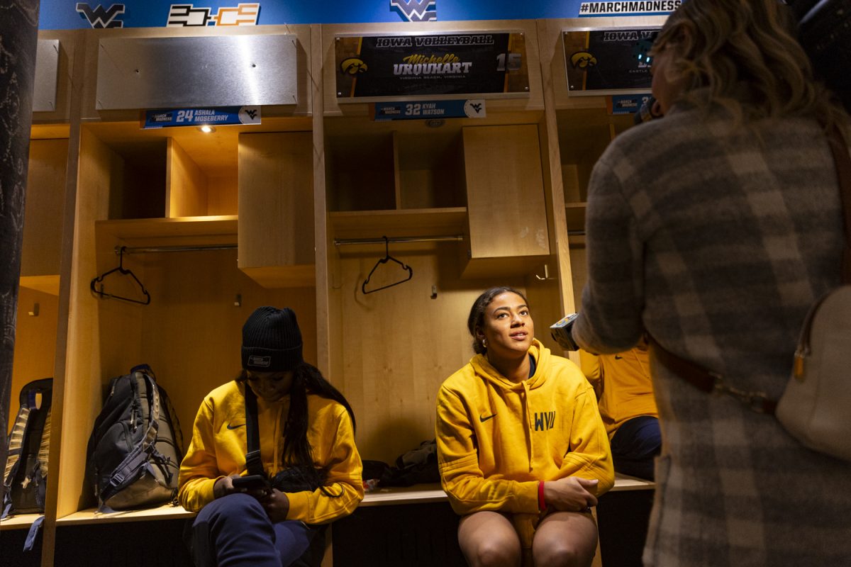West Virginia guard Kyah Watson answers questions from a reporter during a day of press conferences ahead of an NCAA Tournament Second Round game between No. 1 Iowa and No. 8 West Virginia at Carver-Hawkeye Arena in Iowa City on Sunday, March 24, 2024. The Hawkeyes and the Mountaineers face off Monday at 7:00 p.m. CT.