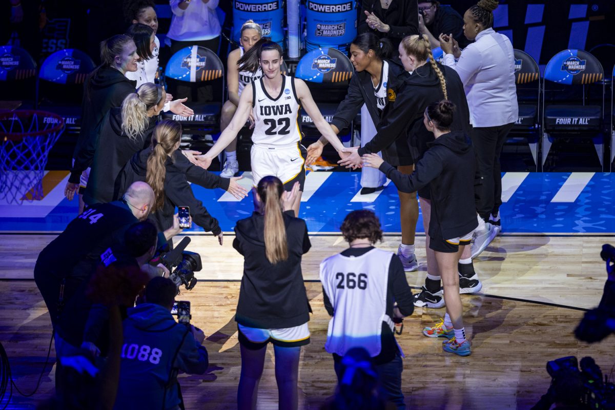 Iowa guard Caitlin Clark walks onto the court during a NCAA Tournament Sweet Sixteen game between No. 1 Iowa and No. 5 Colorado at MVP Arena in Albany, N.Y., on Saturday, March 30, 2024. The Hawkeyes defeated the Buffaloes, 89-68.