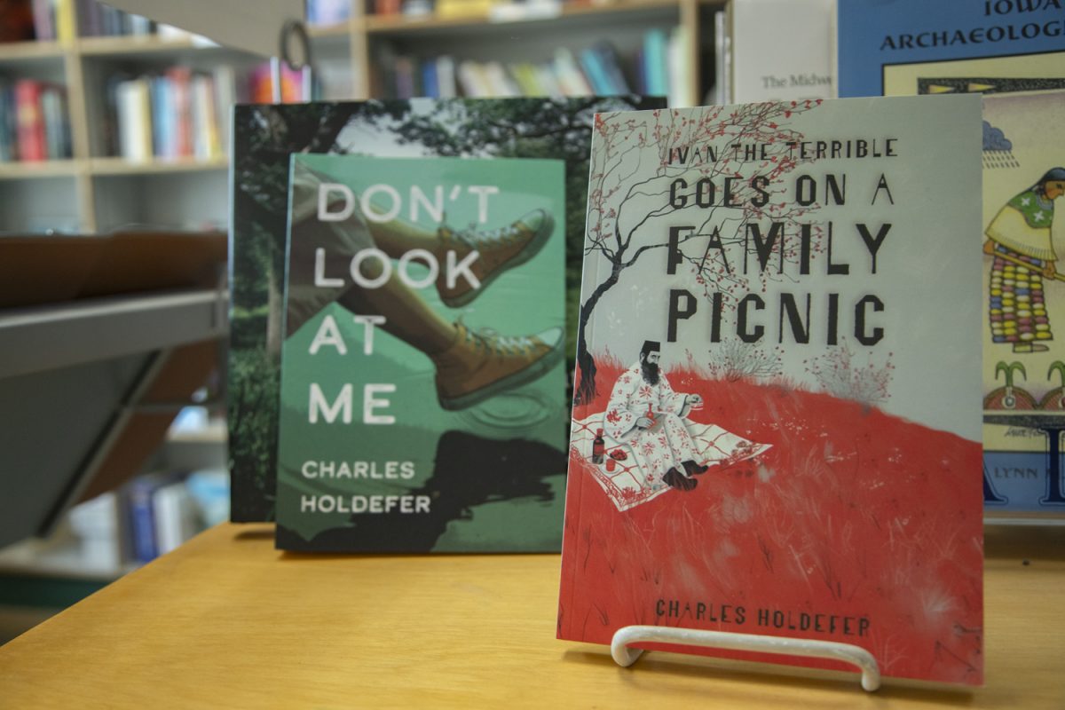 Author Charles Holdefer’s novel “Don’t Look at Me” and most recent book “Ivan the Terrible goes on a Family Picnic” are seen in Prairie Lights in downtown Iowa City on Wednesday, July 17.