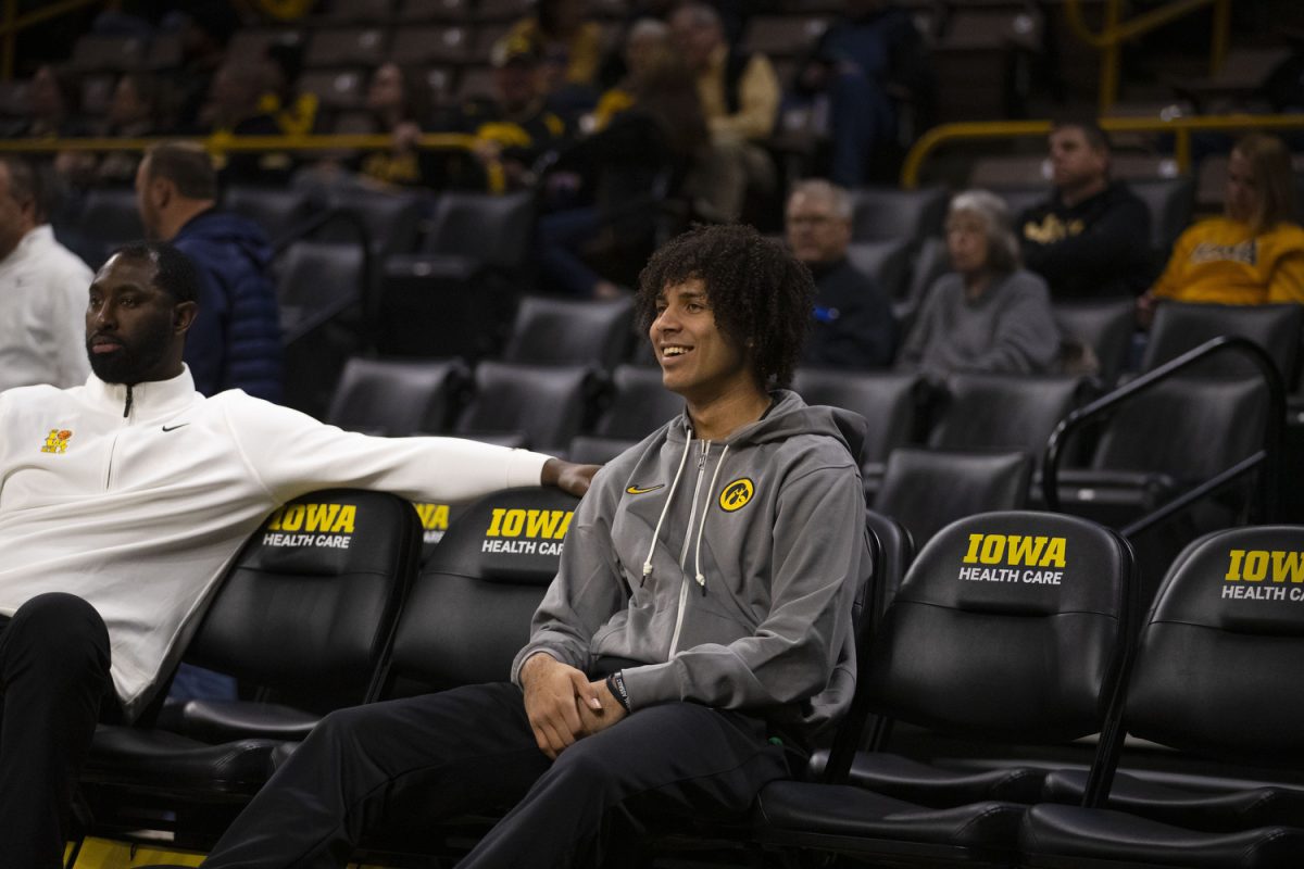 Mid-Year transfer Johnson-Arigu watches as players warmup before a men's basketball game between Iowa and Minnesota at Carver-Hawkeye Arena in Iowa City on Tuesday, Jan. 21, 2024. The Hawkeyes fell to the Gophers 72-67. Iowa head coach Fran McCaffery announced Johnson-Arigus transfer from the University of Miami on Tuesday.