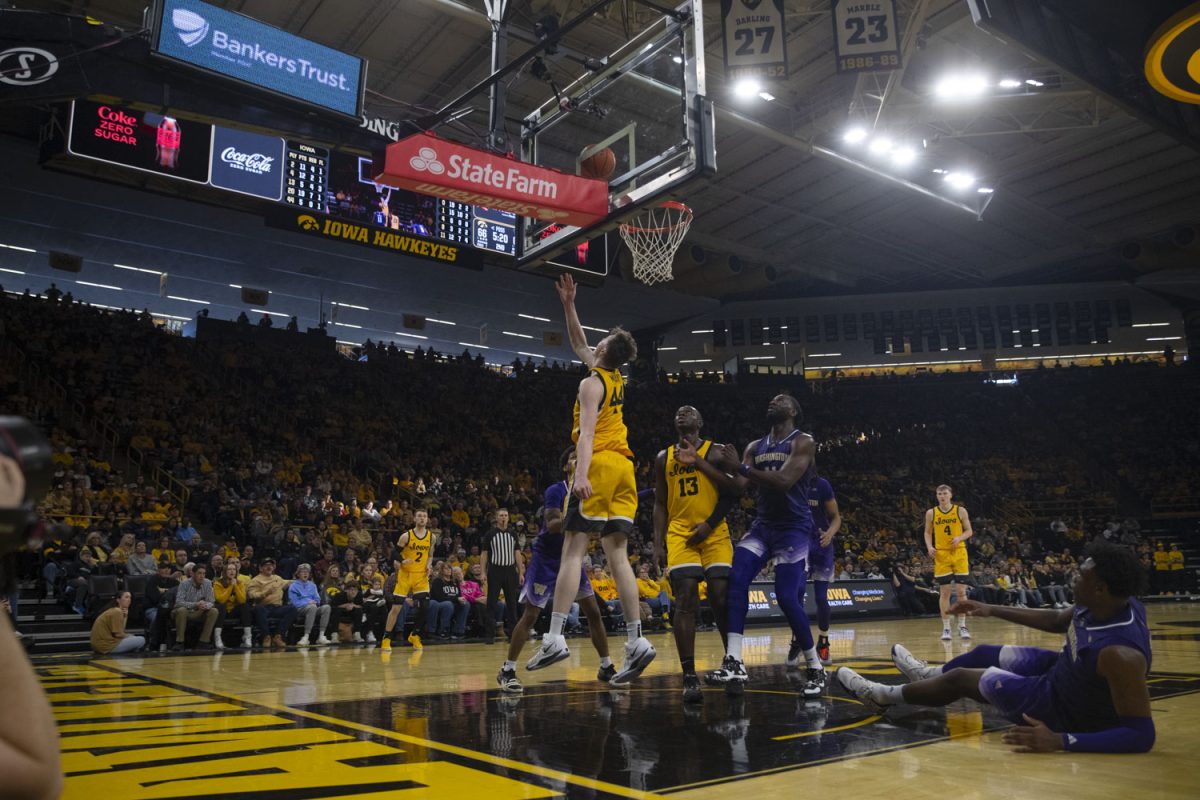 Riley Mulvey performs a layup during a men’s basketball game between Iowa and Washington at Carver-Hawkeye Area in Iowa City, Iowa, on February. 22, 2025. The Hawkeyes defeated the Huskies, 85-79.