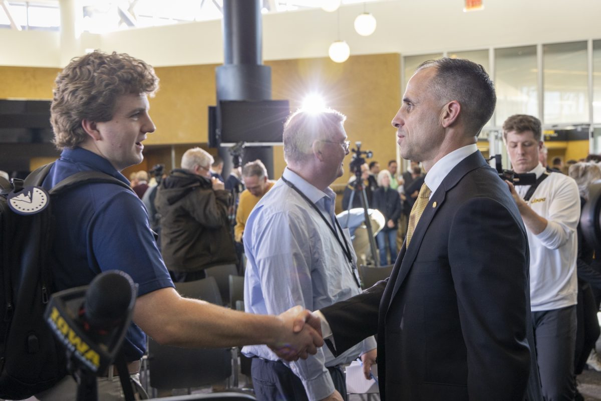 Newly hired Iowa Men’s basketball coach Ben McCollum shakes hands after a press conference at Carver Hawkeye area on March 25, 2025. McCollum is an Iowa City native and held previous coaching jobs at Northwest Missouri State and Drake. His coaching record is 426–95. Wyatt Goodale Daily Iowan.