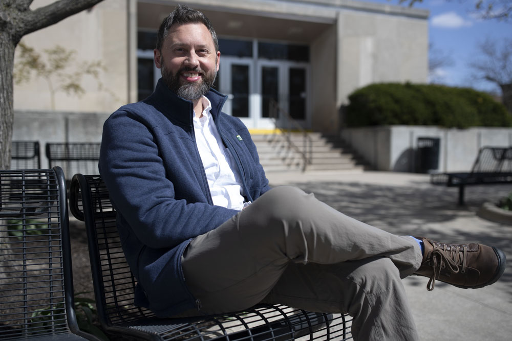 Assistant Professor of Instruction for International Studies Peter Gerlach poses for a portrait in front of Phillips Hall in Iowa City on April 15, 2025. Tomorrow, the Iowa City Public Library will host a Well Earth Sustainability event to highlight how Iowa businesses impact sustainability and the climate.