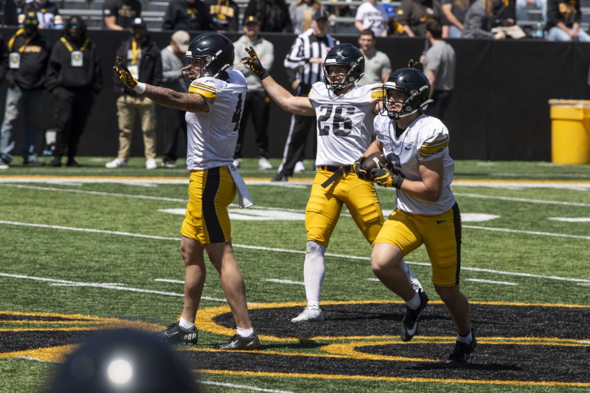 Iowa defensive backs Koen Entringer (4), Kael Kolarik (26), and Zach Lutmer (6), scrimmage during an open spring football practice at Kinnick Stadium on Saturday, April 26, 2025. The Iowa football team’s first game is August 30 against Albany.